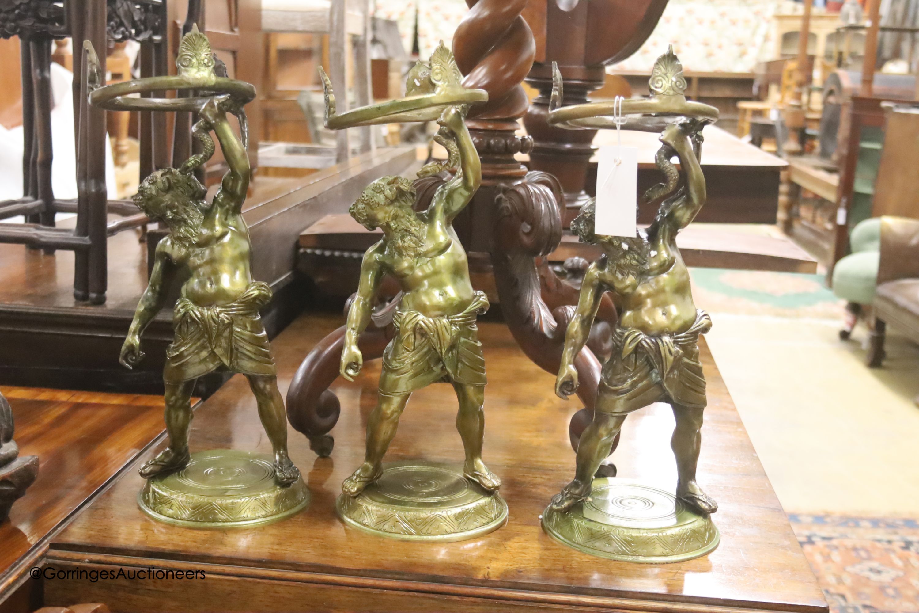 Six cast gilt metal figures of Hercules, height 42cm